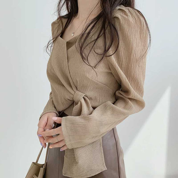 韓国ファッション　無地　特徴のある裾デザイン　秋ブラウス